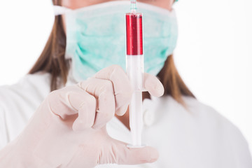 Woman doctor wearing a medical protective mask against coronavirus