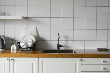 Kitchen sink and faucet. Stainless kitchen sink and tap water. The interior of the modern kitchen...