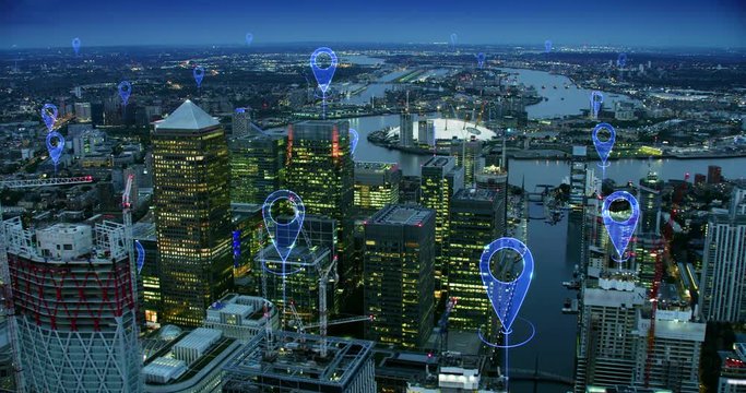 Localization icons over London. Aerial view of a smart and futuristic city. Skyscrapers in the financial district. Perfect to illustrate technological concepts as: data communication, AI, IOT.