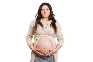 Young attractive pregnant woman holding her belly