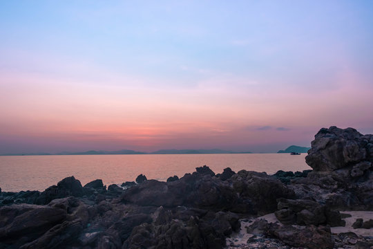 Rocks and sea long exposure landscape in Sunset