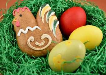 Fototapeta na wymiar Easter decoration with gingerbread and eggs stock images. Gingerbread easter chicken stock images. Rustic Easter decoration images. Spring decoration images. Easter concept