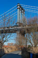 Fototapeta premium Pathway in front of the Manhattan Bridge in Dumbo Brooklyn New York City