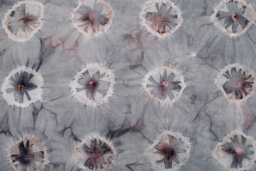 Fragment of hand-dyed fabric strip using shibori dyeing technique