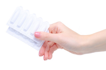 Suppositories in hand health medicine on a white background. Isolation