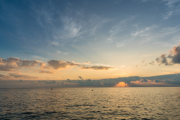 Fototapeta na wymiar Sunset in mediterranean sea at Riomaggiore village in Cinque Terre, Italy.