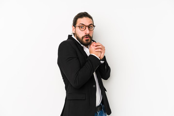 Naklejka premium Young caucasian business man isolated on a white background scared and afraid.