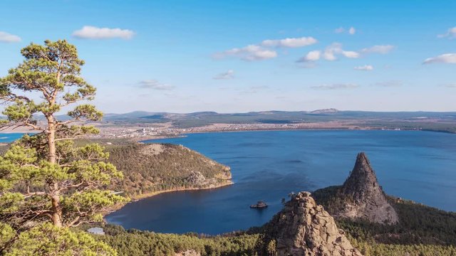 Majestic nature of Kazakhstan concept: epic view of Burabay lake with Okzhetpes and Zhumbaktas rocks from the highest point of Sinyuha Mountain at sunset in autumn season; time lapse