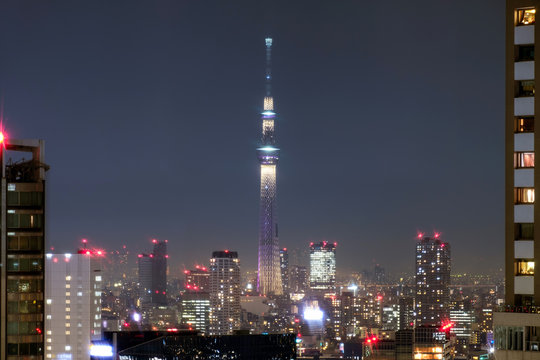 View of city building with Tokyo Skytree at night © Mumemories