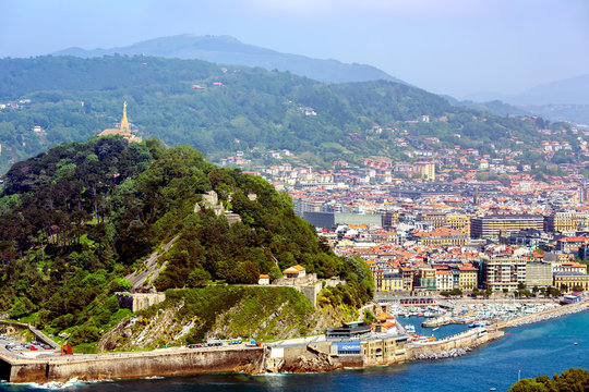 View from mount Igueldo to mount Urgull of the Bay of Biscay on the background of the Pyrenees mountains, San Sebastian, Donostia, Spain