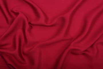 red fabric background with waves
