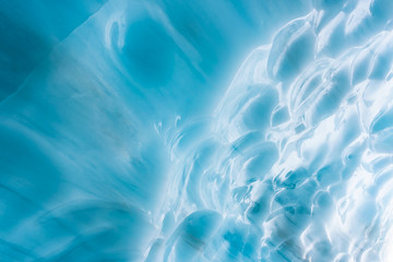 Beautiful Vibrant Blue Colors inside the Ice Cave during a cold winter day. Taken on Blackcomb Mountain, Whistler, British Columbia, Canada. Natural Colorful Background