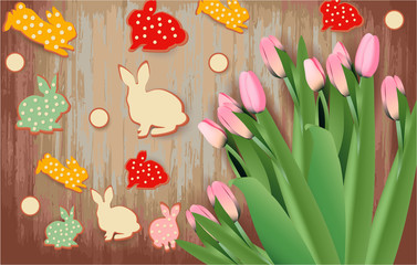 Easter banner with Easter cookies, pink tulips on a wooden background