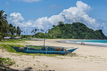 White beach with traditional boat in Philippines