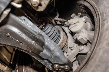 Front driving axle in the car, visible elements of the steering system, view from below the car...