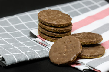 Cookies on a towel isolated on a black background.