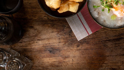 Homemade Thai breakfast, rice porridge and chinese donut on vintage wooden floors