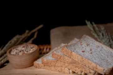 Homemade whole wheat bread, beautifully decorated on a wooden chopping board