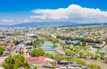 View of Tbilisi city from Narikala Fortressl, old town and modern architecture.  Bridge of Peace Presidential  and Concert Music Theatre Exhibition Hall.  Georgia