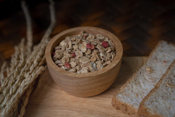 Homemade whole wheat bread, beautifully decorated on a wooden chopping board