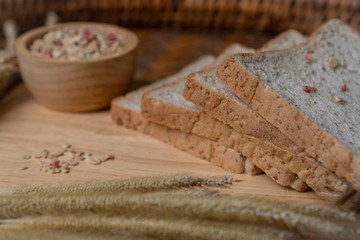 Homemade whole wheat bread, beautifully decorated on a wooden chopping board