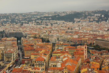 Scenery panoramic city scape view of Nice, France. Traditional red roofs, houses and architecture in Nice. Cote d'Azur France. Luxury resort of French riviera.