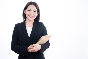 Beautiful Asian businesswoman in a black suit, isolated on a white background.