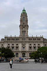Porto City Hall. Pine trees. Blue sky with clouds.