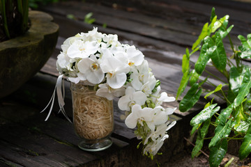 white florist bouquet on green background