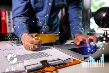 Businessman holding credit card and  laptop for computer,  Business financial and technology.