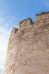 Ancient tower of stone against the sky