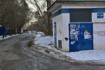 Frozen raw streets of the city paths and parks