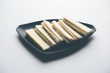 Pootharekulu  is a popular recipe originated from Andhra Pradesh, India.It is a paper-thin sweet or dessert made from rice start/gram flour, jaggery/sugar and clarified butter. Served in a plate.