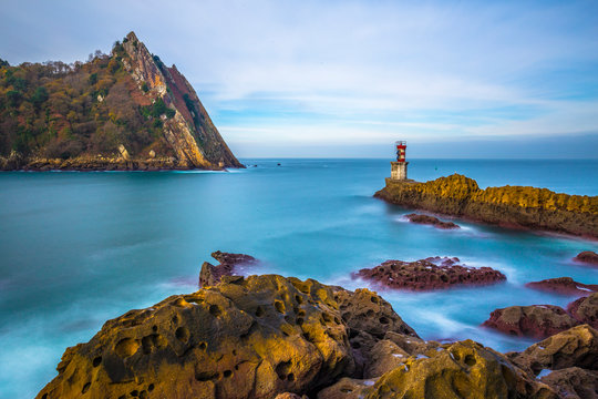 Long exposure of the beautiful surroundings of the lighthouse of Pasaia San Juan at dawn. Basque Country
