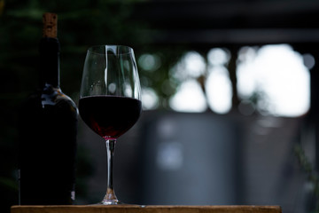 Soft focus red wine in glass on the bar, 
