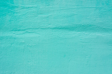 The wall of knowledge is painted in turquoise color. Background, texture