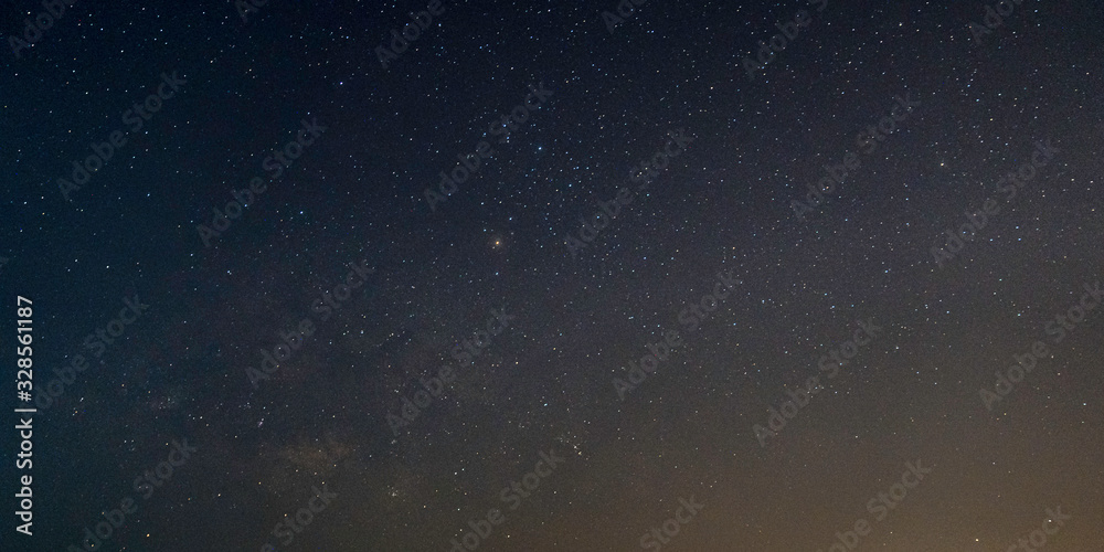 Wall mural view of milky way galaxy with stars on a night sky background