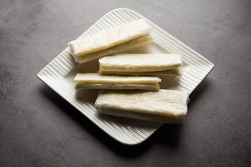 Pootharekulu  is a popular recipe originated from Andhra Pradesh, India.It is a paper-thin sweet or dessert made from rice start/gram flour, jaggery/sugar and clarified butter. Served in a plate.