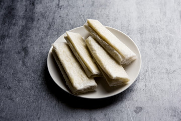 Pootharekulu  is a popular recipe originated from Andhra Pradesh, India.It is a paper-thin sweet or dessert made from rice start/gram flour, jaggery/sugar and clarified butter. Served in a plate.