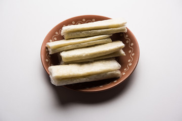 Pootharekulu  is a popular recipe originated from Andhra Pradesh, India.It is a paper-thin sweet or dessert made from rice start/gram flour, jaggery/sugar and clarified butter. Served in a plate.