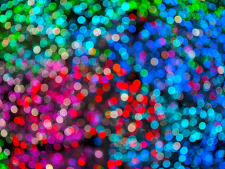 Small lamps of different colors as a texture and background. Festive lighting design. all the colors of the rainbow.