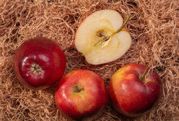 ripe red apples in on a wooden old table
