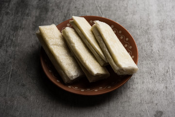 Pootharekulu  is a popular recipe originated from Andhra Pradesh, India.It is a paper-thin sweet or dessert made from rice start/gram flour, jaggery/sugar and clarified butter. Served in a plate.