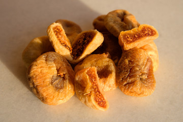 Dried figs and apricots on white background 