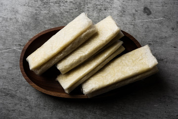 Pootharekulu  is a popular recipe originated from Andhra Pradesh, India.It is a paper-thin sweet or dessert made from rice start/gram flour, jaggery/sugar and clarified butter. Served in a plate.