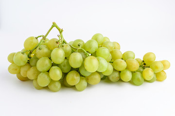 One bunch of ripe organic white grapes isolated on white background, side view