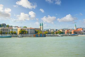 Naklejka premium Church of St. Anne on the Buda side of the Danube river is visible from a boat on the Danube in Budapest, Hungary