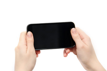 Gadget in the hands. Black phone in hands on a white background
