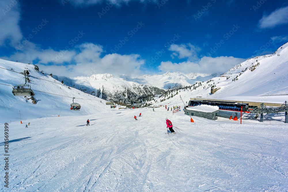 Wall mural Landscape of snowy mountains in the Austrian Tyrol in the middle of a beautiful winter