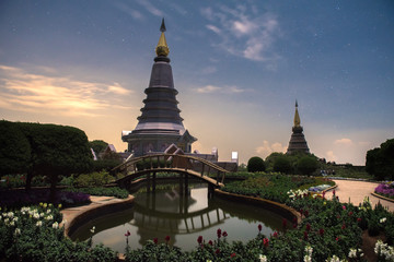 Naklejka premium Beautiful landscape of two pagoda at night, traveling landmarks in Doi Inthanon National Park, Chiang mai, Thailand. 